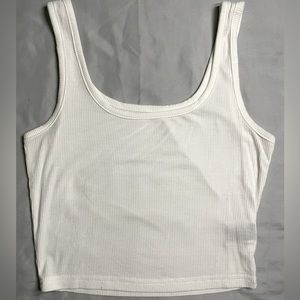 Plain white tank, never worn, a little flowy.